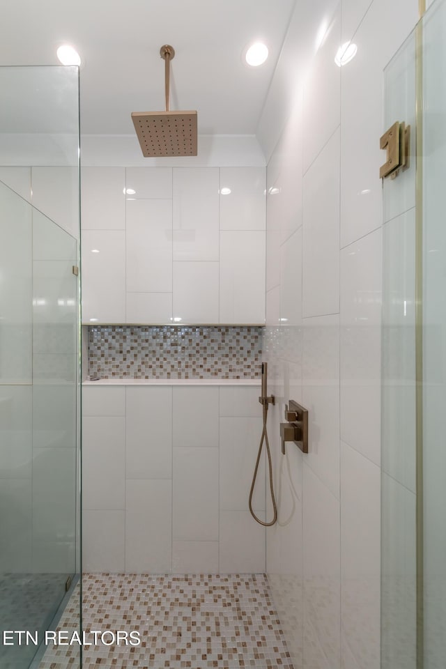 bathroom with tiled shower