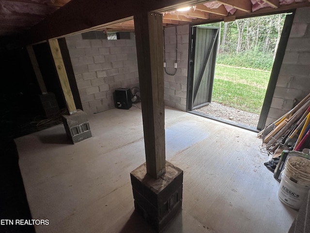 basement featuring a wood stove