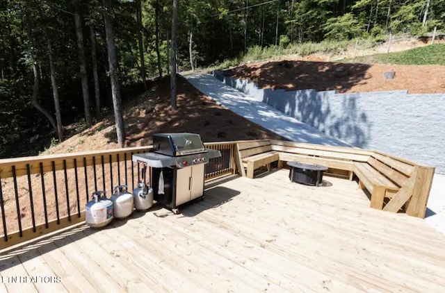 wooden terrace featuring area for grilling