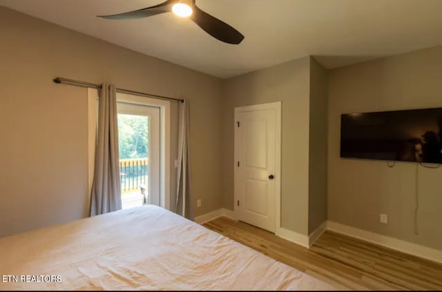 unfurnished bedroom with ceiling fan, access to outside, and light hardwood / wood-style floors