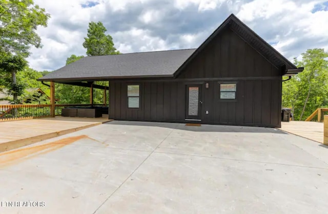 view of front of property with a patio and a deck