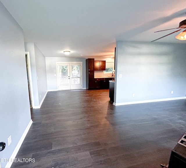 unfurnished room featuring ceiling fan, dark hardwood / wood-style floors, and french doors