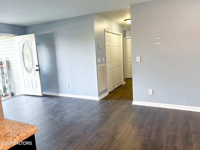 foyer entrance with dark hardwood / wood-style flooring