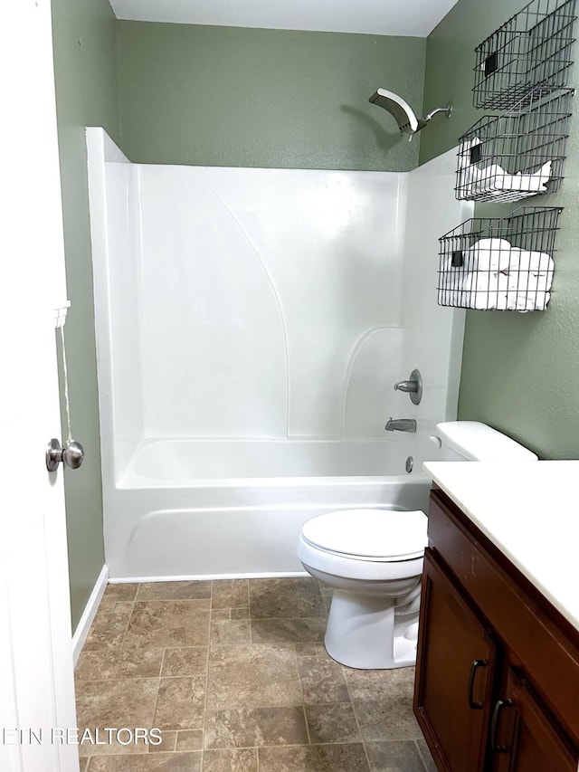 full bathroom featuring bathtub / shower combination, toilet, tile patterned floors, and vanity