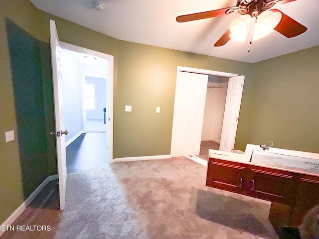 interior space with a closet and ceiling fan