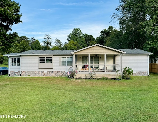 view of front of home featuring covered porch and a front yard