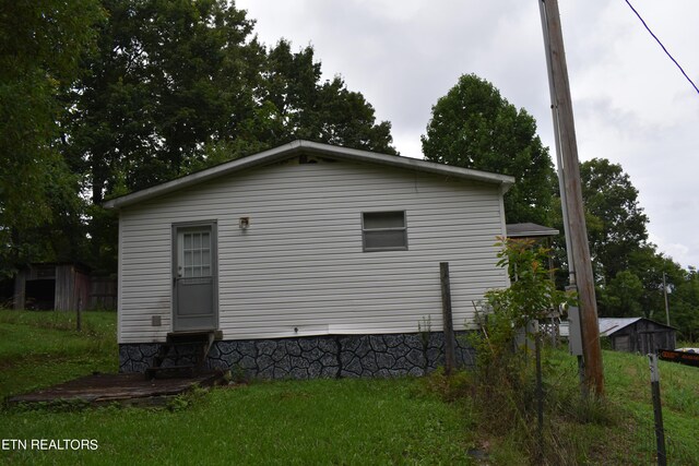 view of property exterior featuring a yard