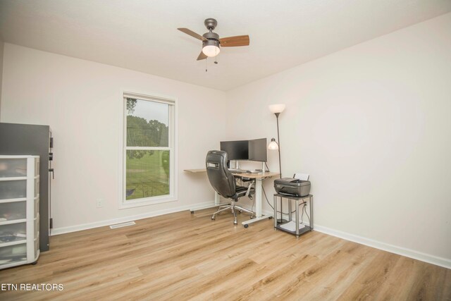 home office featuring ceiling fan and light wood-type flooring