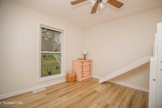 spare room featuring ceiling fan and light hardwood / wood-style flooring