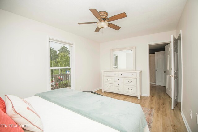 bedroom with ceiling fan and light wood-type flooring