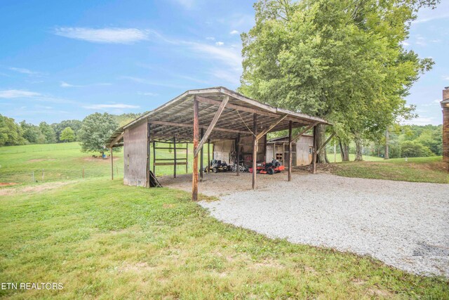 view of outbuilding with a yard