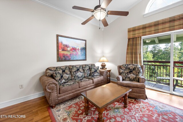 living room with hardwood / wood-style floors, ornamental molding, ceiling fan, and a healthy amount of sunlight