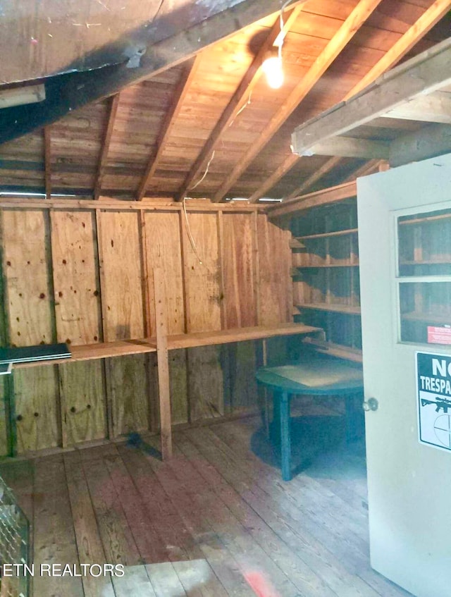 basement with hardwood / wood-style flooring and wooden ceiling