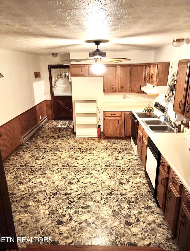 kitchen featuring a baseboard heating unit, sink, a textured ceiling, white appliances, and ceiling fan