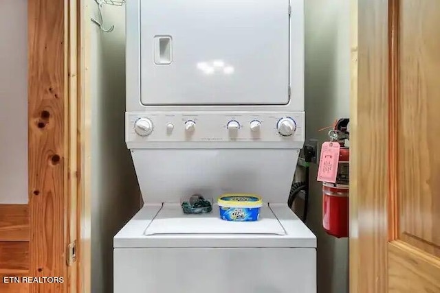 laundry room with stacked washer and clothes dryer