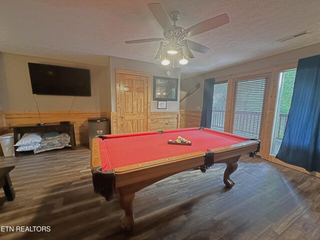 rec room with ceiling fan, pool table, wood-type flooring, and a textured ceiling