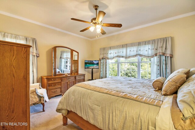 bedroom featuring light carpet, crown molding, and ceiling fan