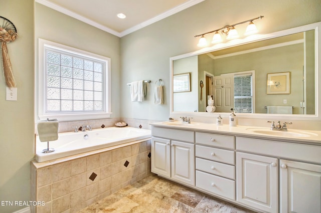 bathroom featuring vanity, tiled tub, and crown molding