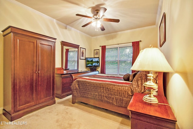 bedroom featuring ceiling fan, ornamental molding, and light carpet