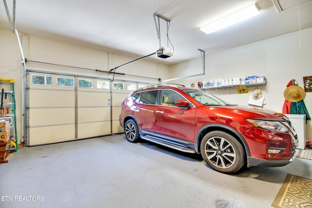 garage featuring a garage door opener