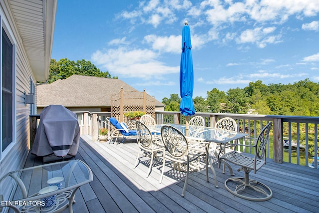 wooden deck featuring area for grilling