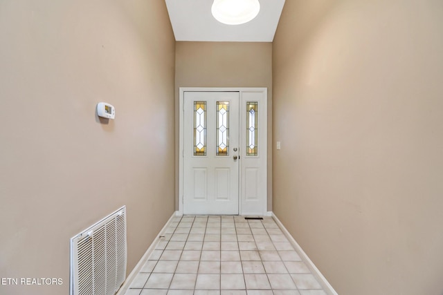 entryway featuring light tile patterned flooring