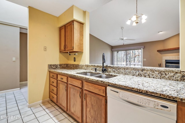 kitchen with ceiling fan with notable chandelier, dishwasher, sink, light tile patterned floors, and light stone countertops