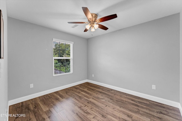 empty room featuring ceiling fan and wood-type flooring