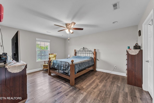 bedroom featuring dark hardwood / wood-style flooring and ceiling fan