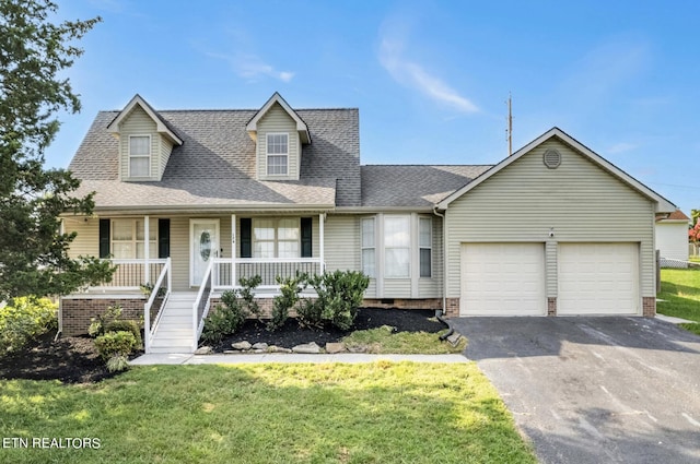 cape cod home featuring a porch, a garage, and a front lawn