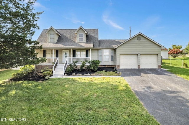 cape cod-style house with a garage, a front yard, and covered porch