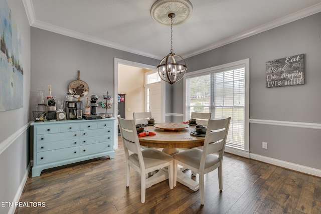 dining room featuring a notable chandelier, dark hardwood / wood-style floors, and ornamental molding