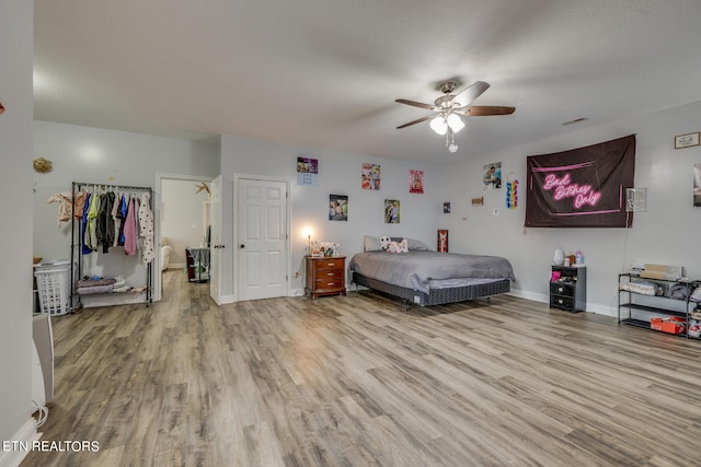 bedroom featuring ceiling fan and light wood-type flooring