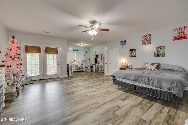 bedroom featuring ceiling fan and hardwood / wood-style flooring