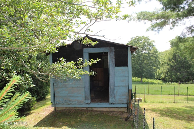 view of outdoor structure with a lawn