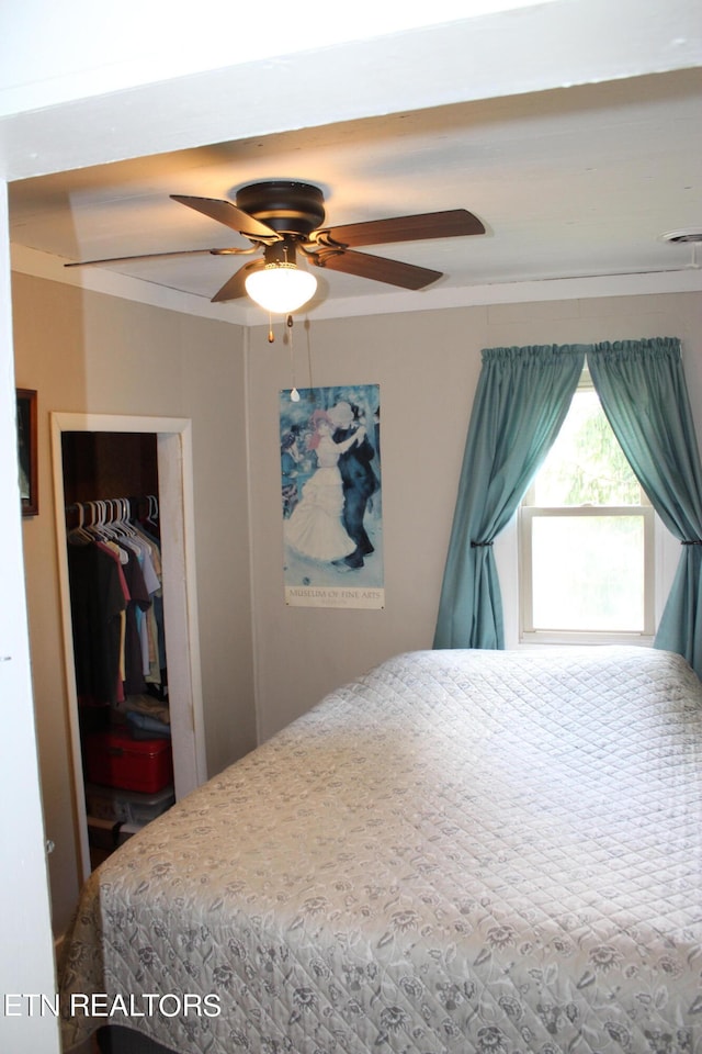 bedroom featuring ceiling fan and a closet