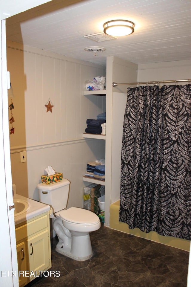 full bathroom featuring tile patterned flooring, vanity, shower / tub combo, and toilet