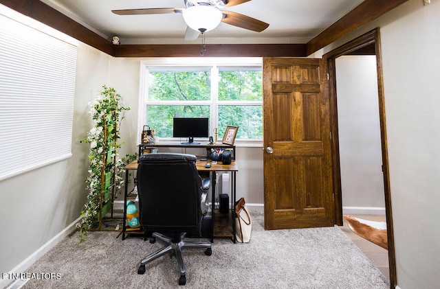 tiled home office featuring ceiling fan