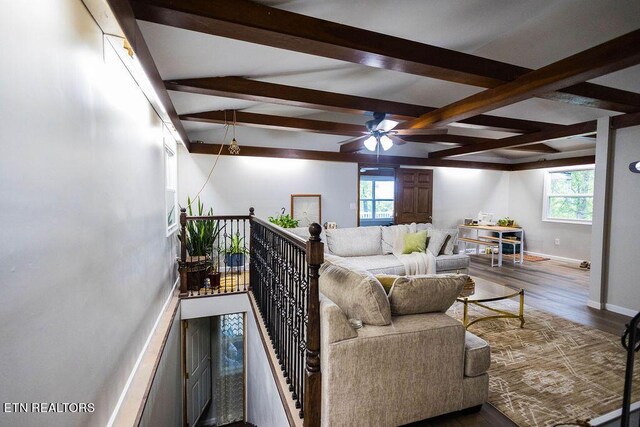 living room with beamed ceiling, ceiling fan, and hardwood / wood-style flooring