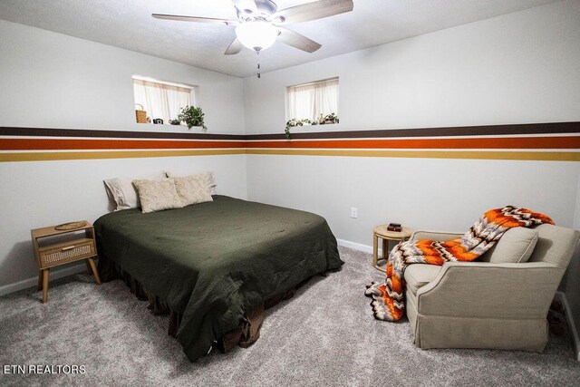 bedroom with ceiling fan and carpet flooring