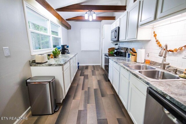 kitchen with stainless steel appliances, beam ceiling, decorative backsplash, sink, and white cabinets