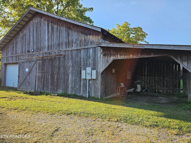 view of outbuilding with a lawn