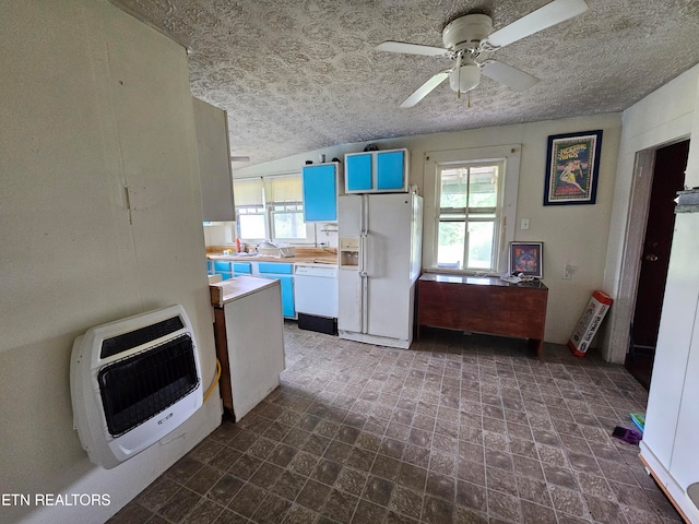 kitchen featuring dark tile patterned flooring, butcher block countertops, a textured ceiling, white appliances, and ceiling fan