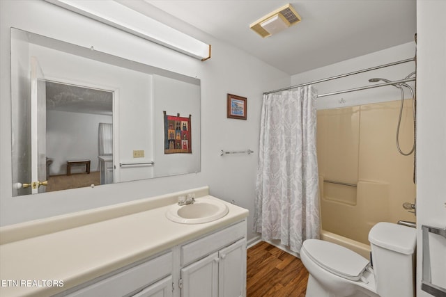 full bath featuring toilet, wood finished floors, vanity, visible vents, and shower / bath combination with curtain