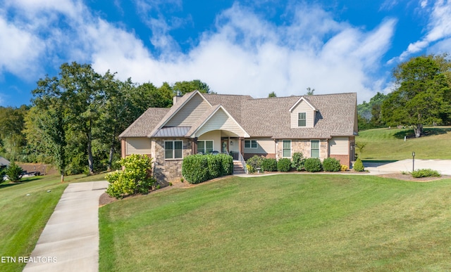 view of front of home with a front yard and a porch