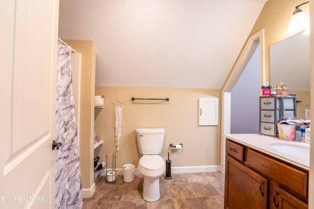 bathroom featuring vaulted ceiling, vanity, a shower with curtain, and toilet