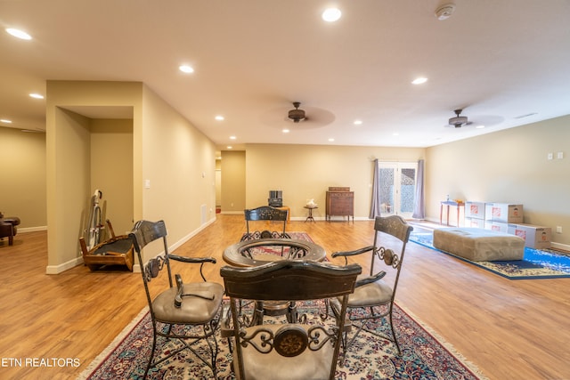 dining room featuring ceiling fan and light hardwood / wood-style flooring