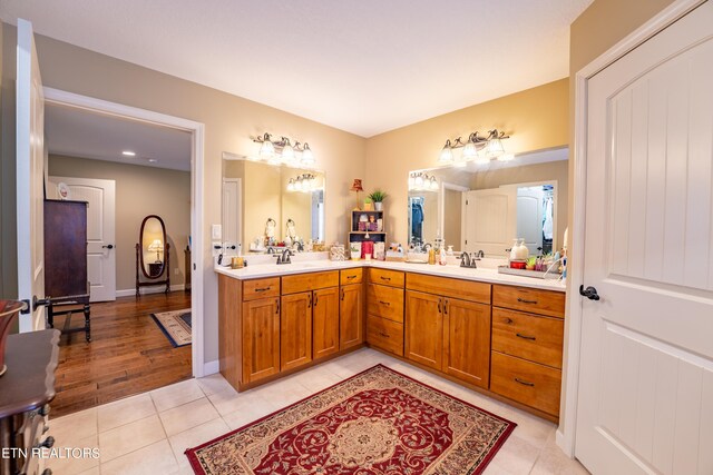 bathroom featuring vanity and hardwood / wood-style flooring