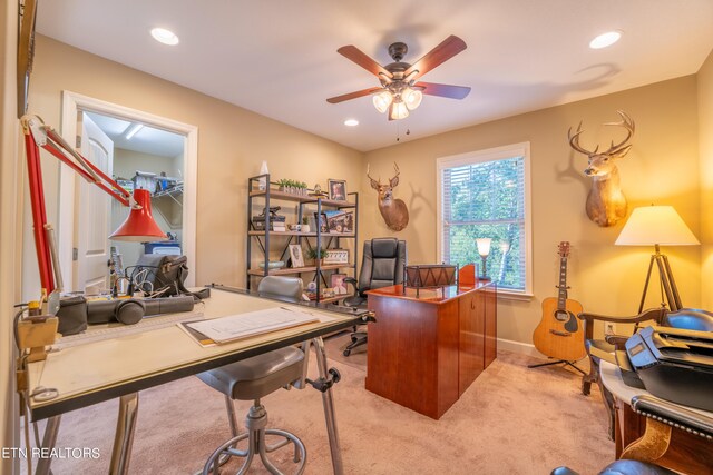 office space featuring ceiling fan and light colored carpet