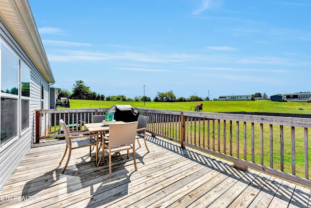 wooden deck featuring a yard